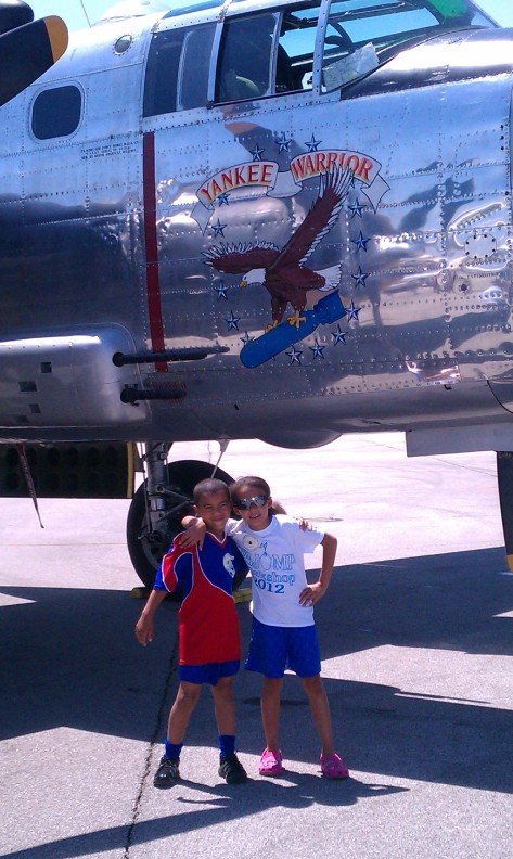 My children with a B-25 like those their great-grandfather repaired