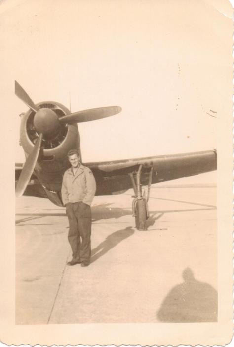 Harry in front of one of the planes he repaired